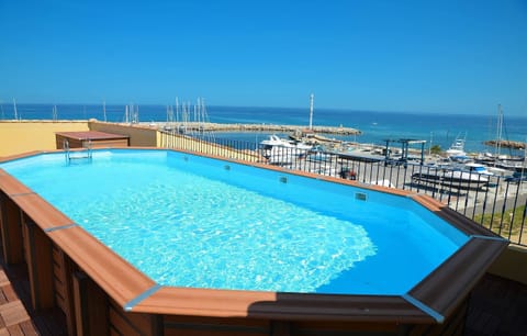 The unbelievable rooftop pool is great for cooling off and enjoying spectacular views of the marina