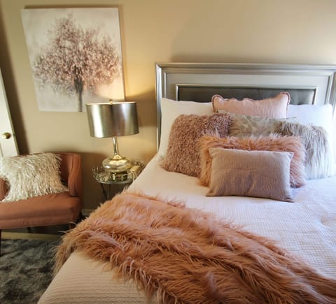 Second bedroom offers queen size bed with full wall closet overlooking courtyard