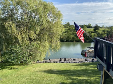 Private beach with fire pit and dock. 