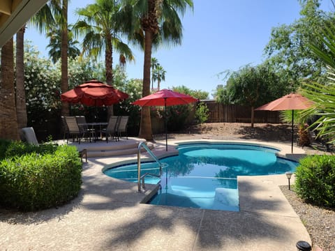 private yard with comfortable setting,, BBQ, firepit, and mature landscaping 
