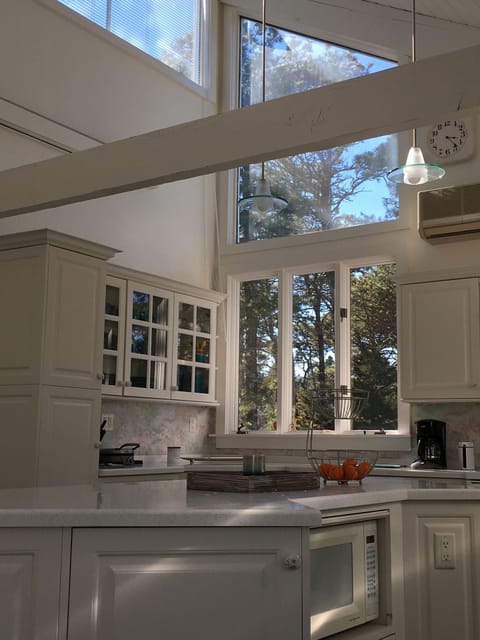 Large kitchen has tons of storage and is stocked with everything you need