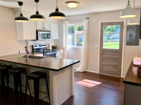You'll love the open concept, fully stocked kitchen!