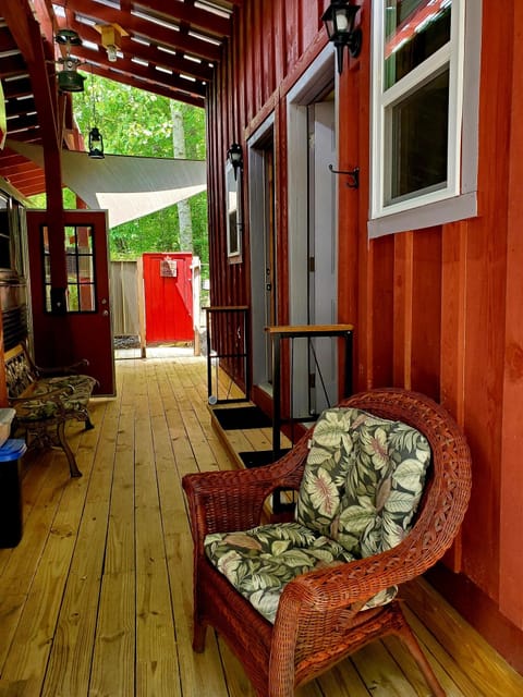 Covered deck connecting bus to bunkhouse.