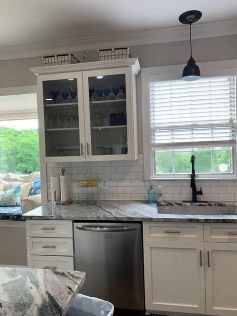 New granite, backsplash and cabinet fronts in our renovated kitchen.