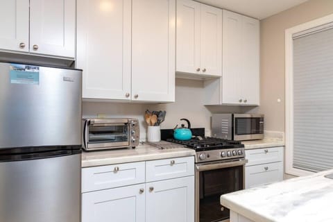 Coffee maker, toaster oven, full fridge, oven/stove, microwave