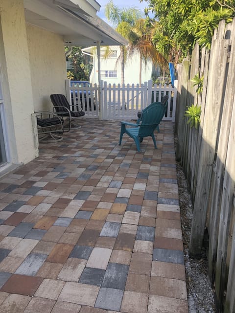 Front patio to door. Sit and relax here on chairs. Enjoy the great weather.