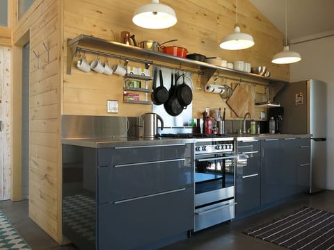 An open galley Kitchen has everything you need to cook your own meals. 