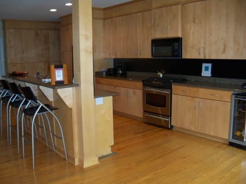 Kitchen complete with gas stove, microwave, refrigerator, wine frig, etc.
