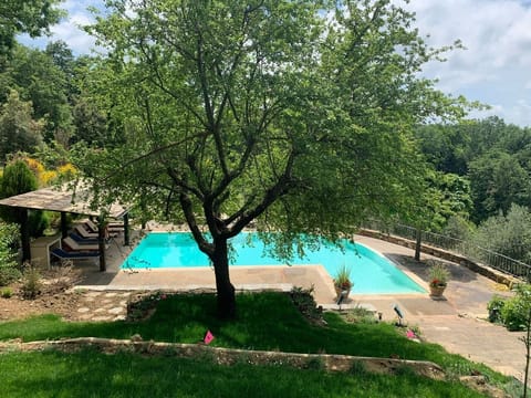 Infinity panoramic pool with a patio for some shade. All fenced around