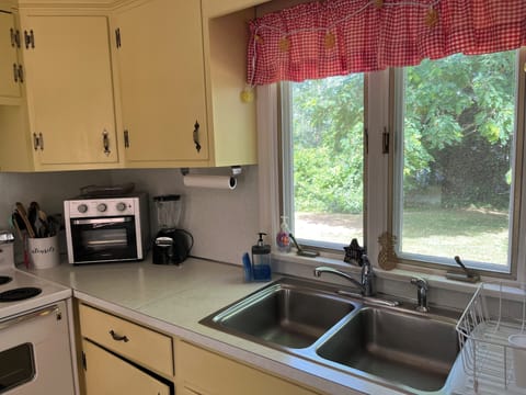 Kitchen; stocked with spices, baking pans, Mickey Mouse pancake maker, and more!