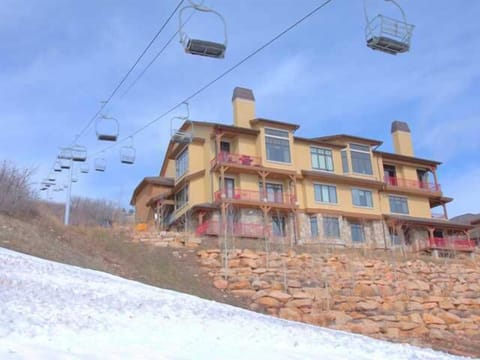 Unit exterior next to chairlift.  Gondola and orange express are to the right