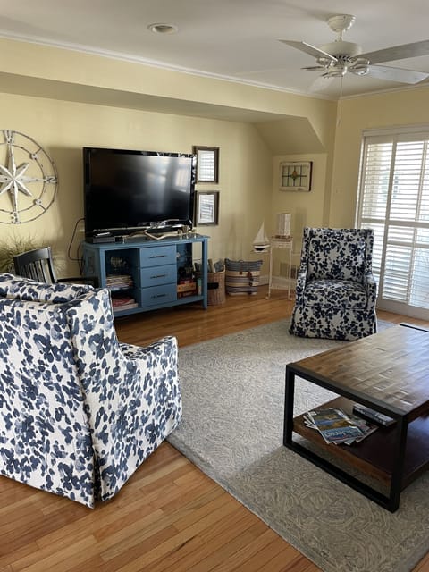 spacious living room with walk out deck