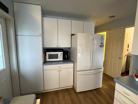 kitchen with dishwasher, electric stove & oven, microwave and drip coffee maker
