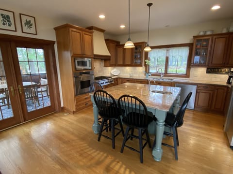 Ideal kitchen for entertaining.  Next to dining room, screened porch, and deck.