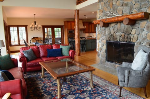 Great Room looking on to dining room, kitchen and outdoor screened porch