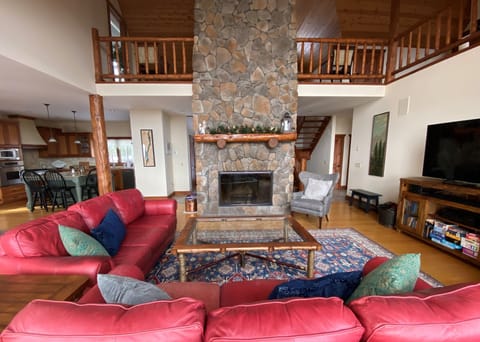 Great Room with large 2 story stone wood burning fireplace (wood provided)