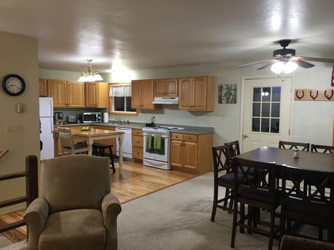 Open concept upper floor with large well equipped kitchen