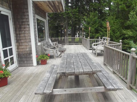 Front deck porch overlooks the forest and the water
