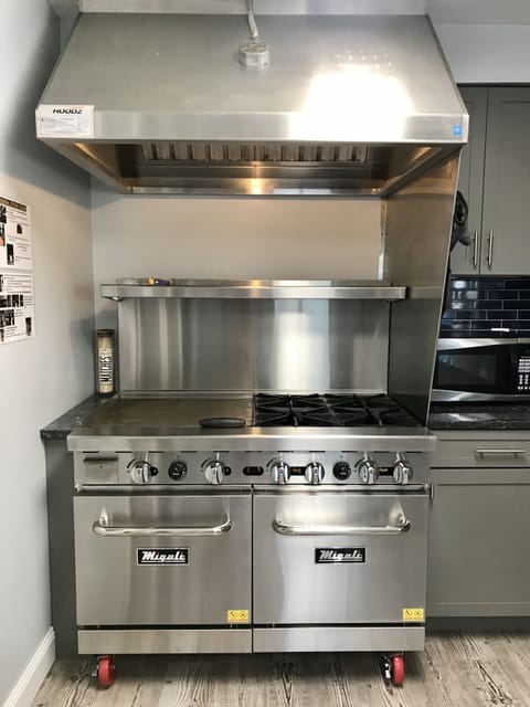 Industrial stove with oversized ovens, double griddle, 4 large burners