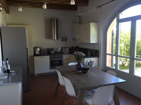 Fully stocked kitchen looking out on to private courtyard