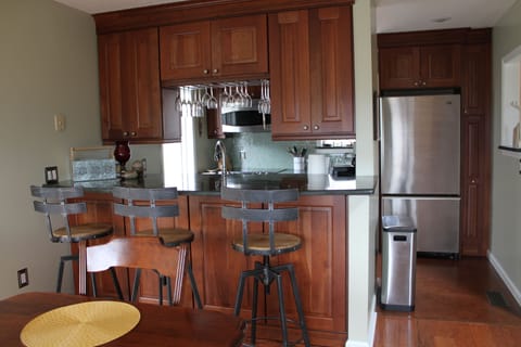 Modern kitchen with gorgeous cabinets and granite countertops.