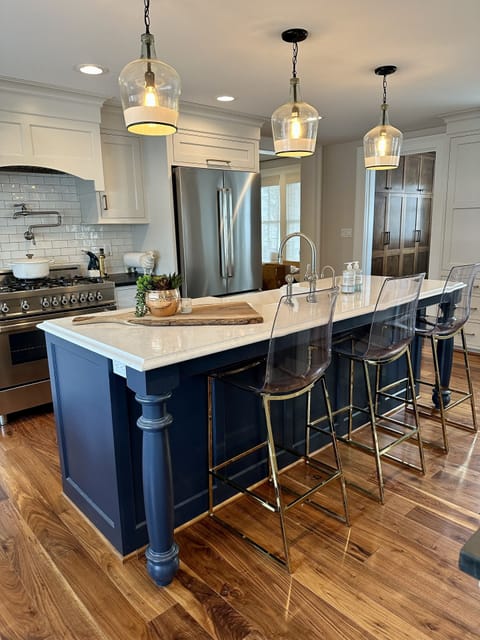 kitchen island with three bar stools