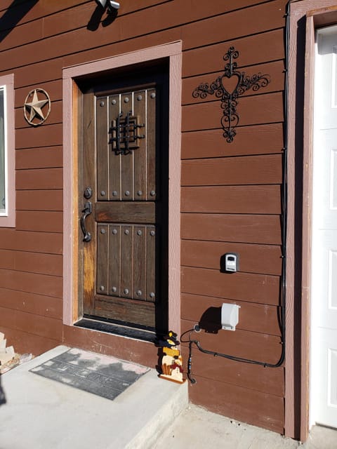 Front Door with Lock box to the right, key to front door is inside lock box.