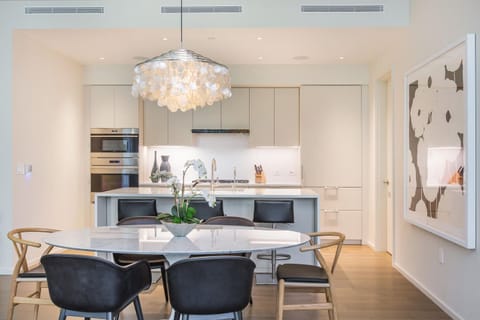 Enjoy gourmet meals or casual bites in this beautiful dining space that connects seamlessly to the kitchen for a functional and elegant experience.