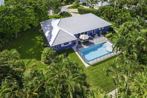 Nestled on a private cul-de-sac one block from the beach with a heated pool.