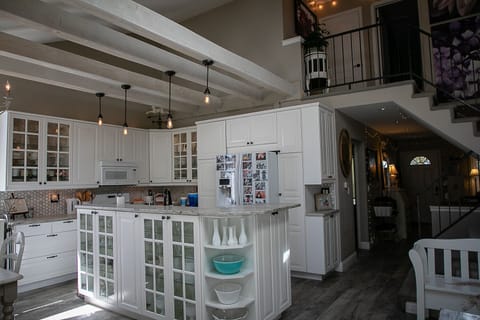 Fully stocked kitchen w access to everything you need to prepare food at home.