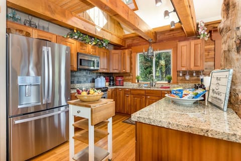 Beautiful kitchen with SS appliances and sky lights above!