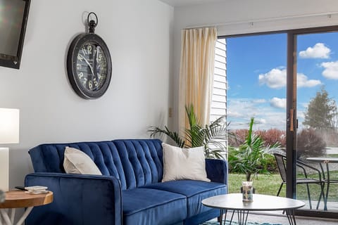 A futon sofa bed graces the room, with a captivating lake view accessible from the adjacent balcony.