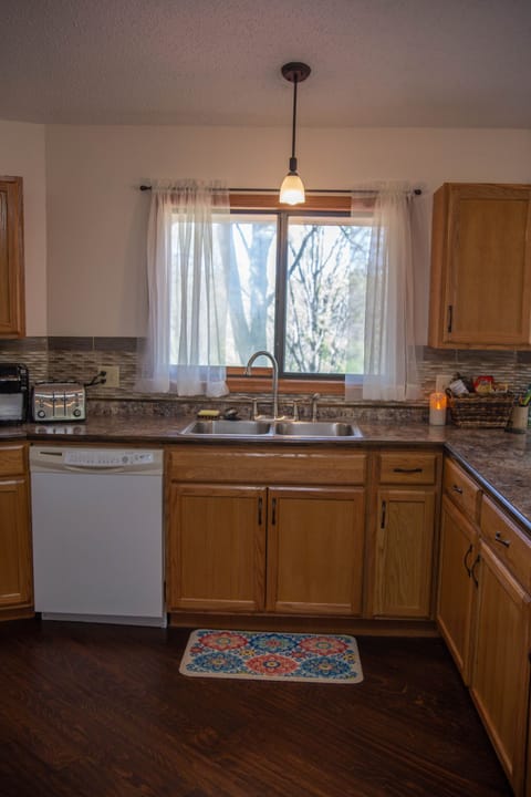 Watch the birds eat from the feeder just outside the kitchen window