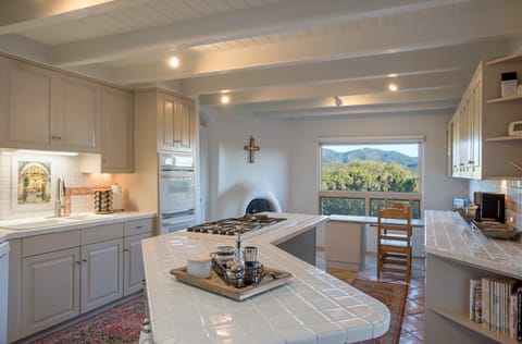 Huge, fully equipped kitchen w/ gas Dacor range & tons of storage/counter space