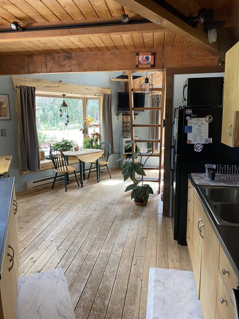 Entering the kitchen and home.