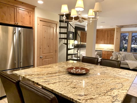 Granite kitchen table looking into living room