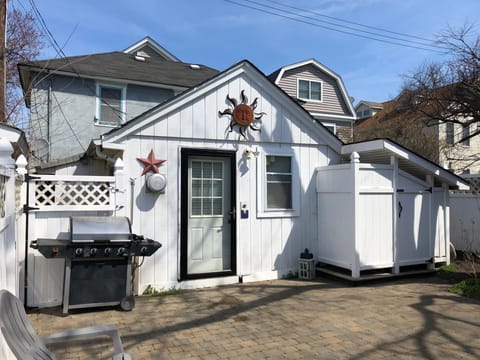 Front of house, including grill and outdoor shower 