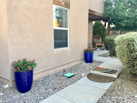 Walking towards front door.