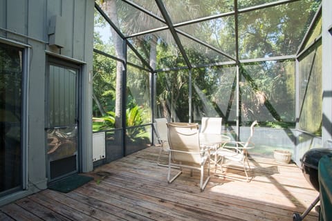 - Dine outdoors without the bugs on this screened in patio surrounded by greenery
- Glass top table and seating for four create a breezy retreat for morning coffee
- Tranquil space to relax and enjoy the Florida sunshine and shade
