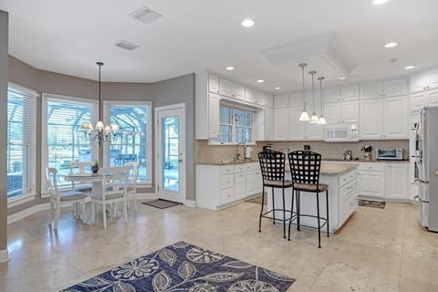 - Bright kitchen layout with island seating, pendant lights, and a cozy breakfast nook
- Enjoy your coffee beside panoramic bay windows with peaceful outdoor views
- Perfect mix of comfort and function for morning meals or evening prep