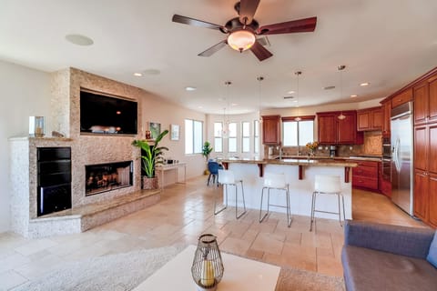 Great room with living room, dining room, and kitchen.