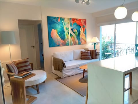 Living room with a spacious balcony, plenty of light. 