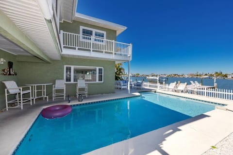 Lounge the Day Away by the Sparkling Blue Waterfront Pool!