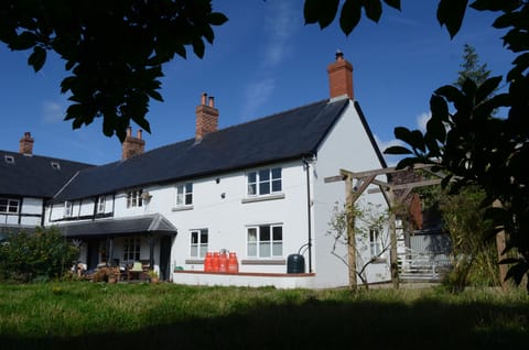 The cottage from the garden, showing own driveway and gateway