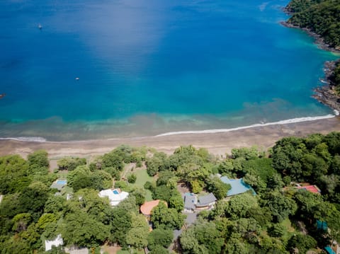 Aerial view of the house. It really is in front of the beach