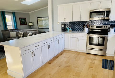 Open concept kitchen/living/dining rooms.