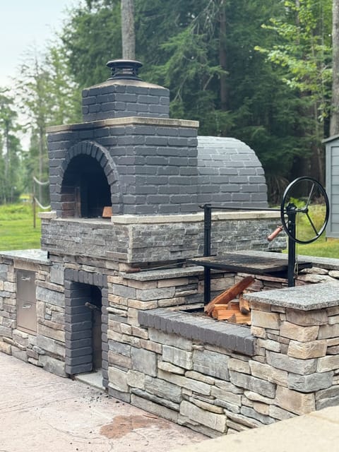 Prep area and Pizza Oven and wood fire Grill Lower patio