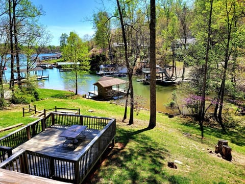 Relax on a spacious yard with a subtle incline and direct lakefront access.