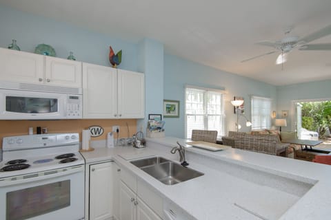 Kitchen with bar open to living area
