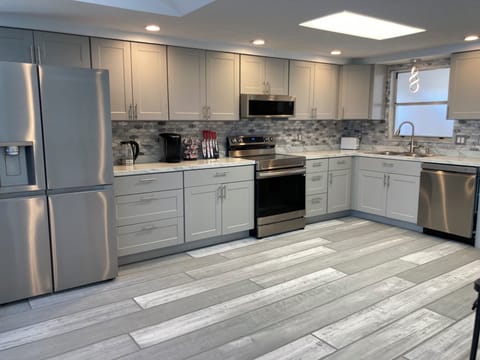 very large kitchen with fridge, stove, microwave, garbage disposal & dishwasher